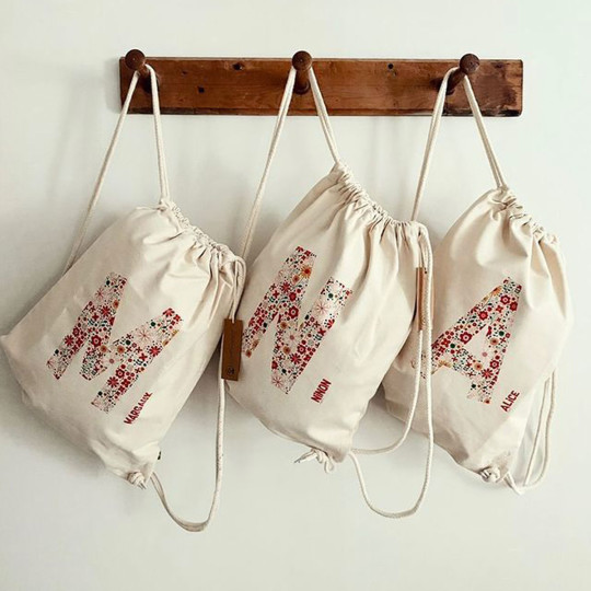 personalised rucksack initial and flowers for school and sports