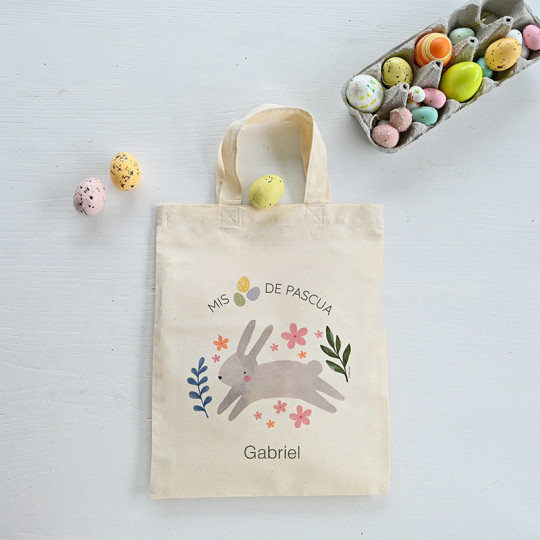 bolsa de huevos de pascua con conejito saltando y motivos florales