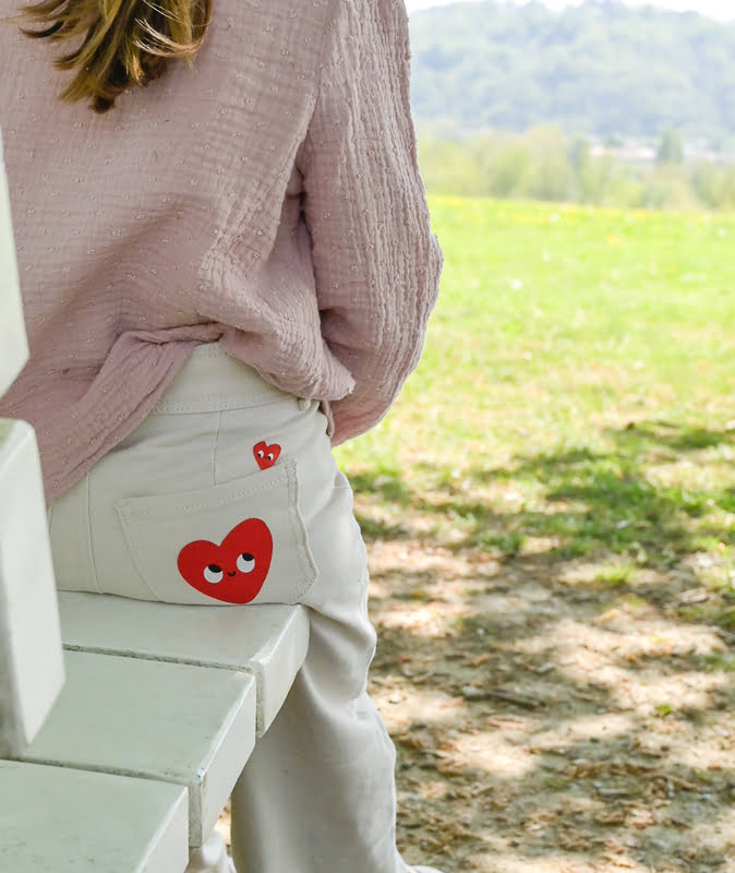iron on a patch to mend all holes on trousers, clothes
